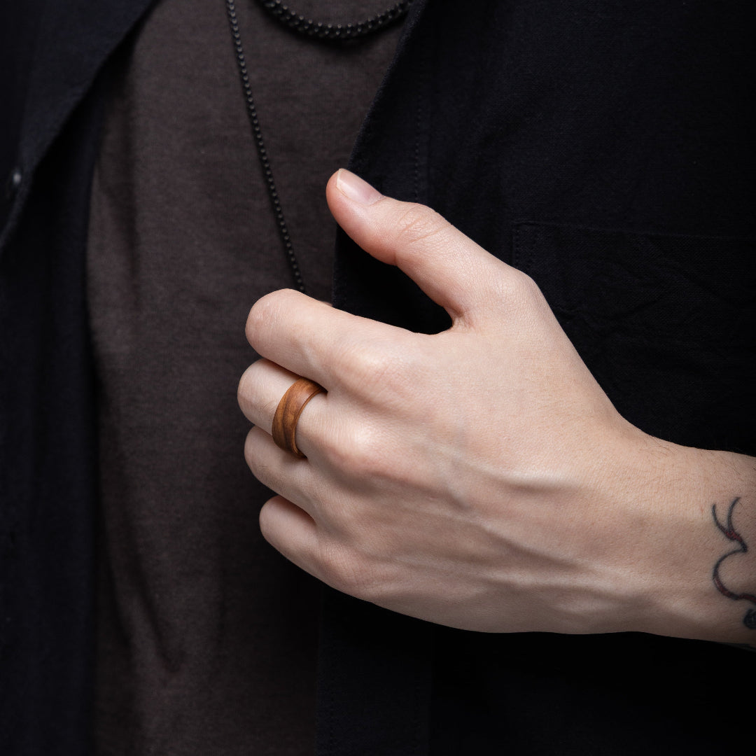 LinkRing Balance olive wood lookbook photo, worn by model dressed in dark elegant clothes